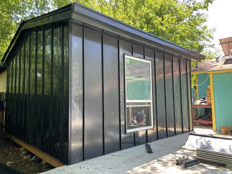 Black standing seam metal wall panels for Roof Inspection in Richland Hills