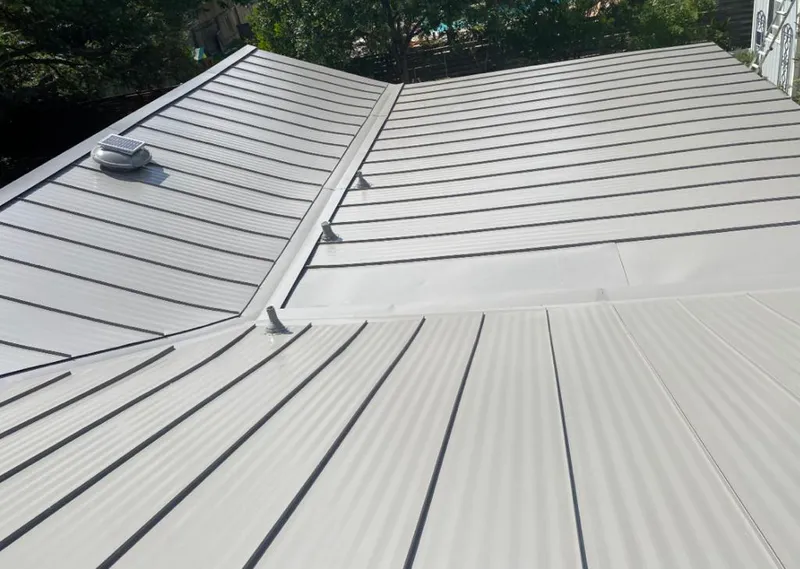 Solar attic fan installed on a metal roof for Roof Ventilation in Richland Hills